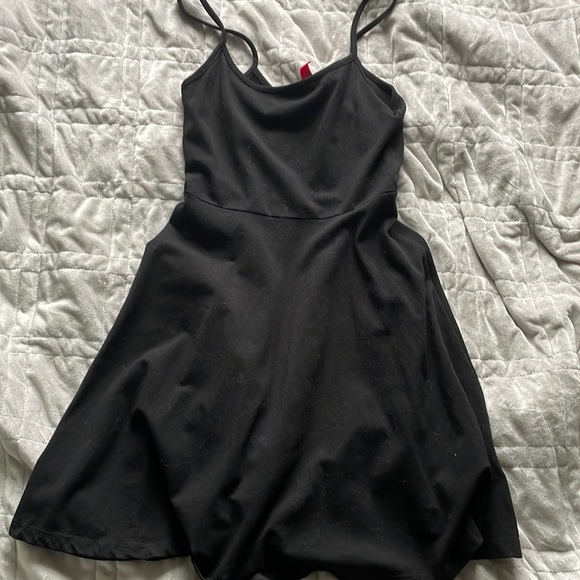 Divided little black mini dress, cotton material. Fits size XS. - Picture 1 of 2